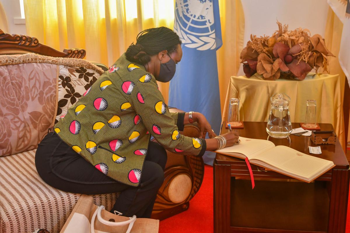 H.E Mrs Umutoni Signing the Visitors Book