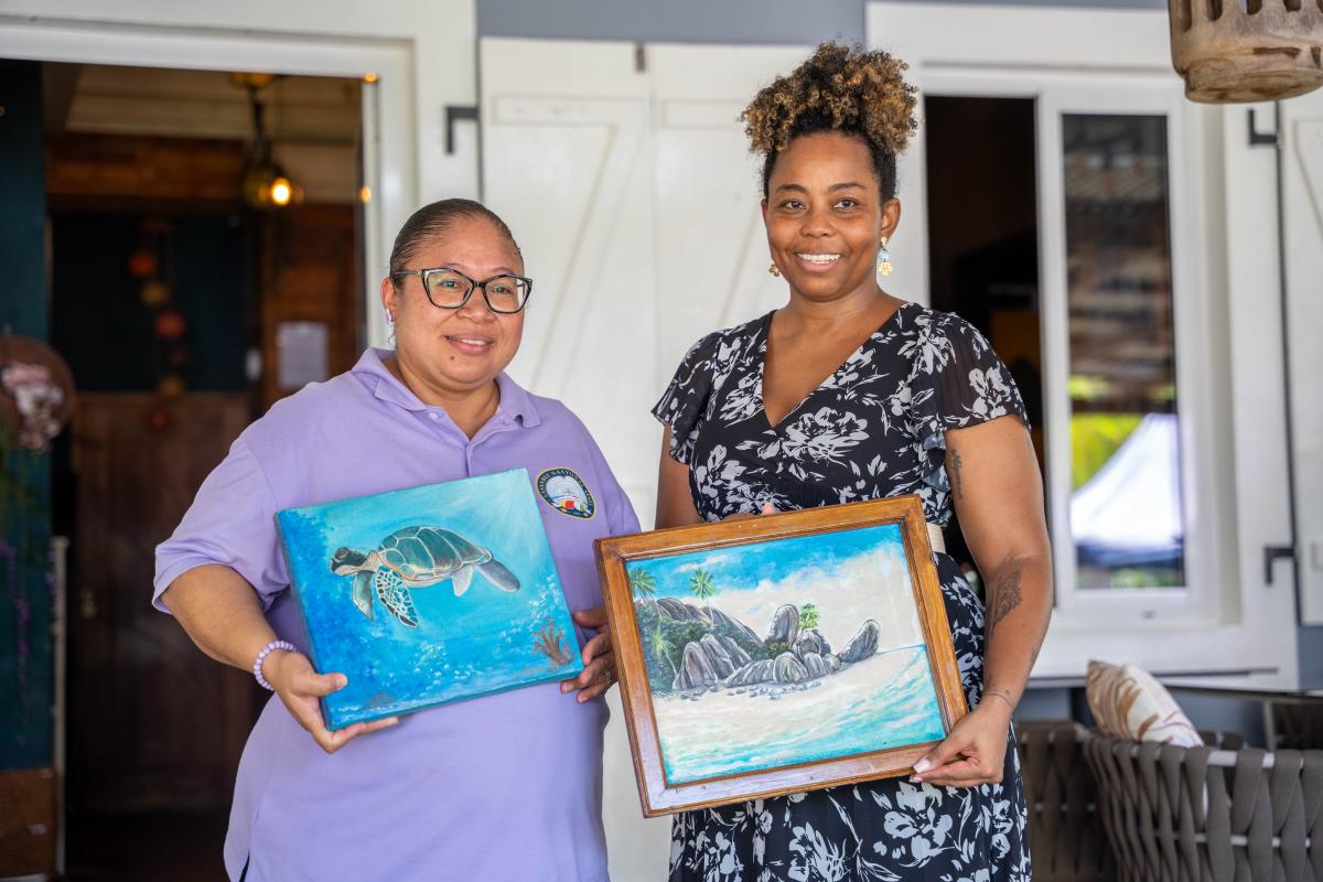 Gifted paintings presented to Speaker Hon. Azarel Ernesta and Chairperson Hon. Audrey Vidot