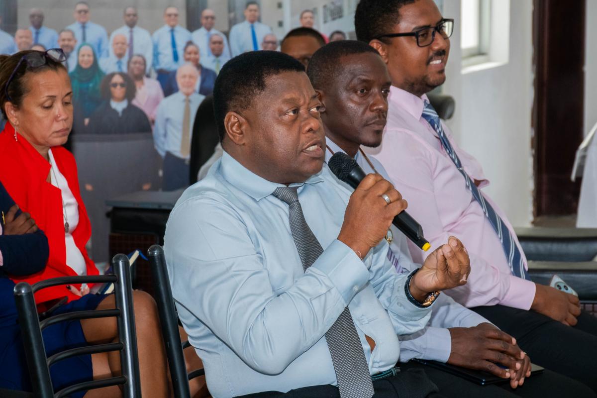 Hon. Churchill Gill intervening