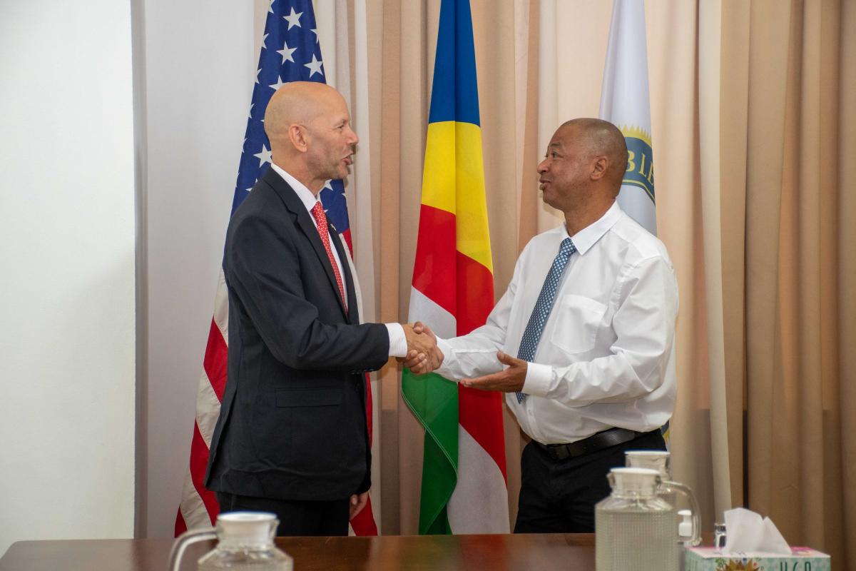 Hon. Andre and Chargé D’Affaires Mr. Loutfi shaking hands